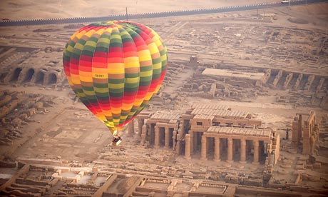 A tourist balloon flies over the temple of Medinet Habu near Luxor, Egypt
